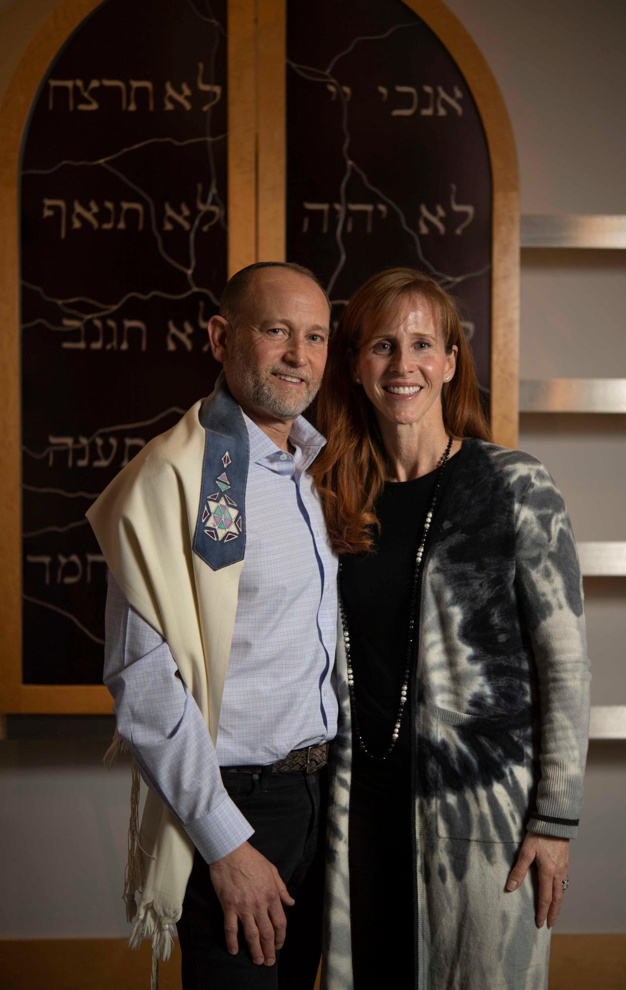 Rabbi Philip "Flip" Rice and Laurie Rice stand together at the Congregation Micah in Brentwood, Tenn., Monday, Feb. 8, 2021. They've been running a reform Jewish Temple together since 2006. They are the first and only married rabbi couple in Nashville.