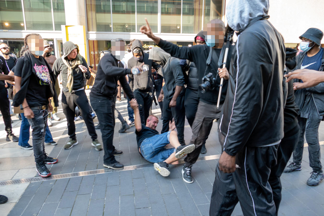 People are pictured around the man. (Vincenzo Lullo/SWNS)