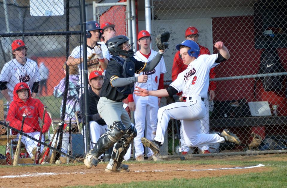 North Hagerstown's Luke Frazee slides home with a run against Frederick on March 29, 2023. Frazee hit a pair of doubles in the Hubs' 10-0 victory.