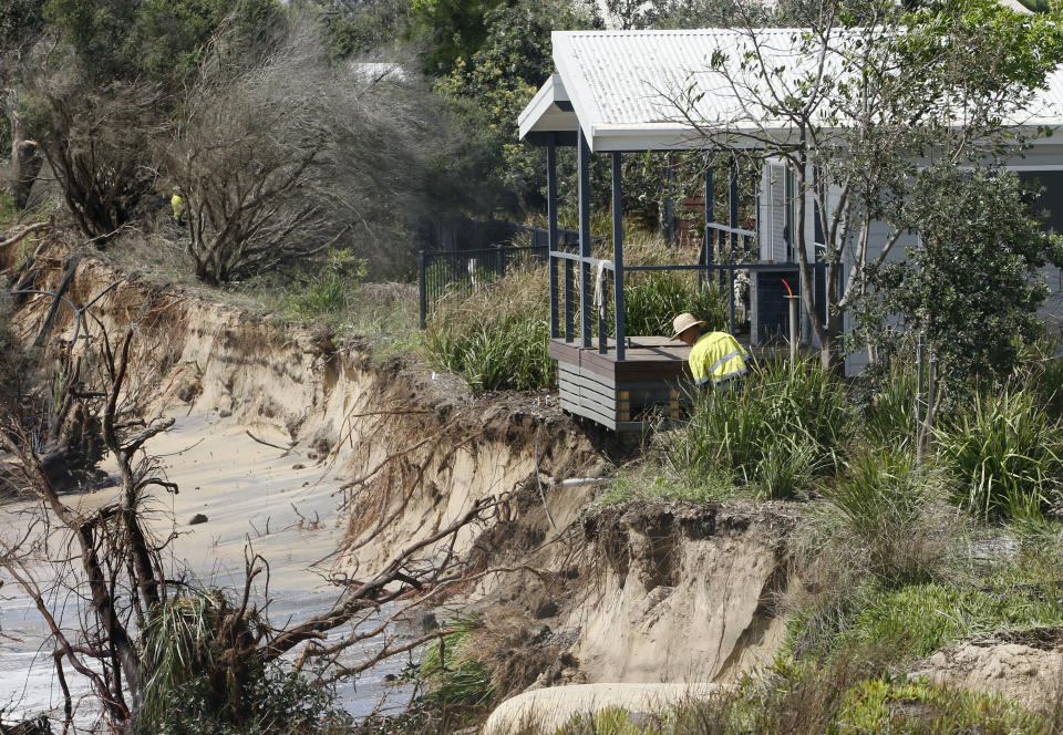 Newcastle City Council prepare to use a crane to move cabins from the council owned Stockton Caravan Park. Source: AAP