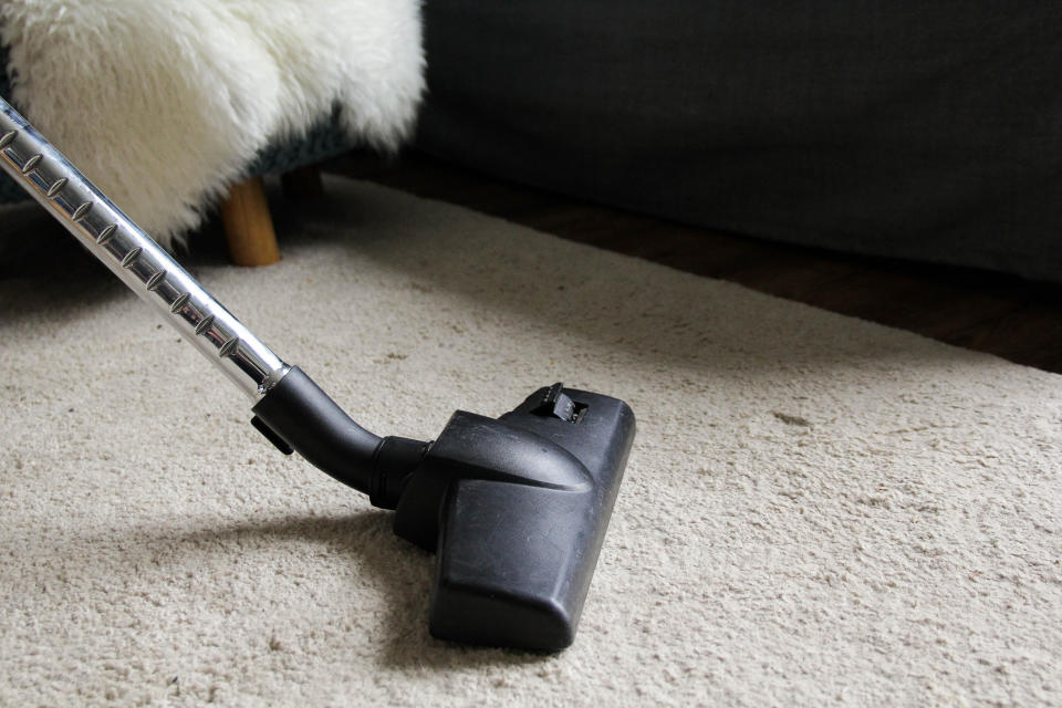 vacuuming on a carpet