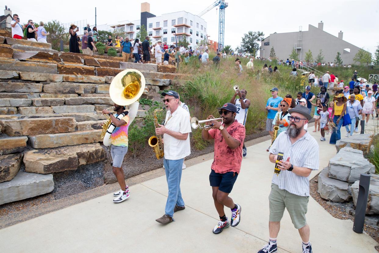 The Lucky Seven Brass Band performs and leads a parade down to the entrance to the newly renovated Tom Lee Park prior to the ribbon cutting to officially open it to the public in Downtown Memphis on Saturday, September 2, 2023.