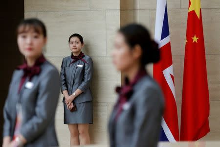 Members of staff wait for officials arrive for UK-China High Level Financial Services Roundtable at the Bank of China head office building in Beijing, China July 22, 2016. REUTERS/Damir Sagolj