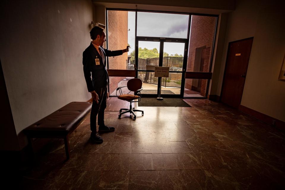 H. Alexander Rich, executive director and chief curator of the Polk Museum of Art, points toward construction happening outside the north end of the building. The museum is undergoing its first major expansion since the current building opened in 1988.