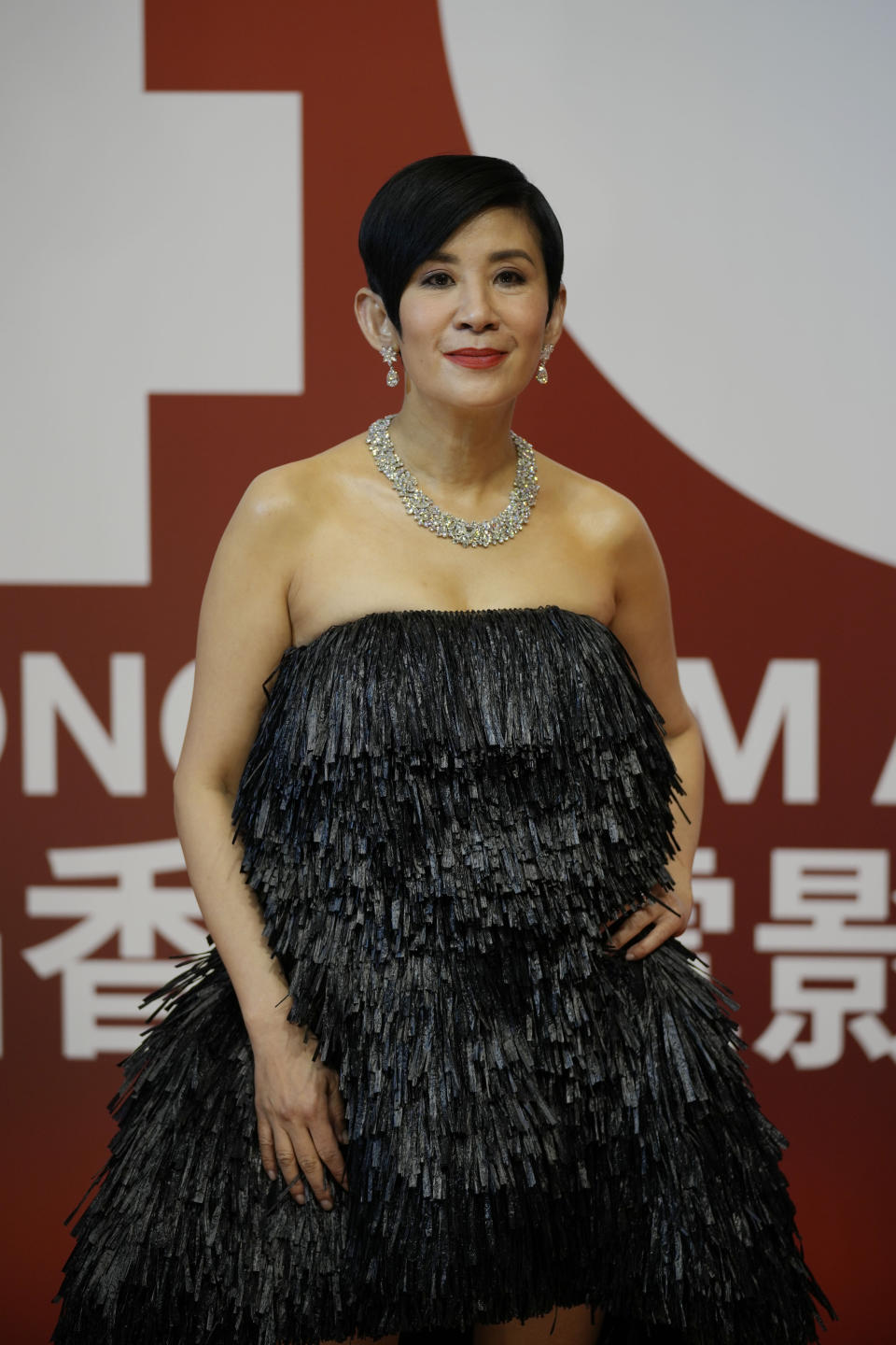 Hong Kong actress Sandra Ng poses on red carpet at the Hong Kong Film Awards, Sunday, July 17, 2022. (AP Photo/Kin Cheung)