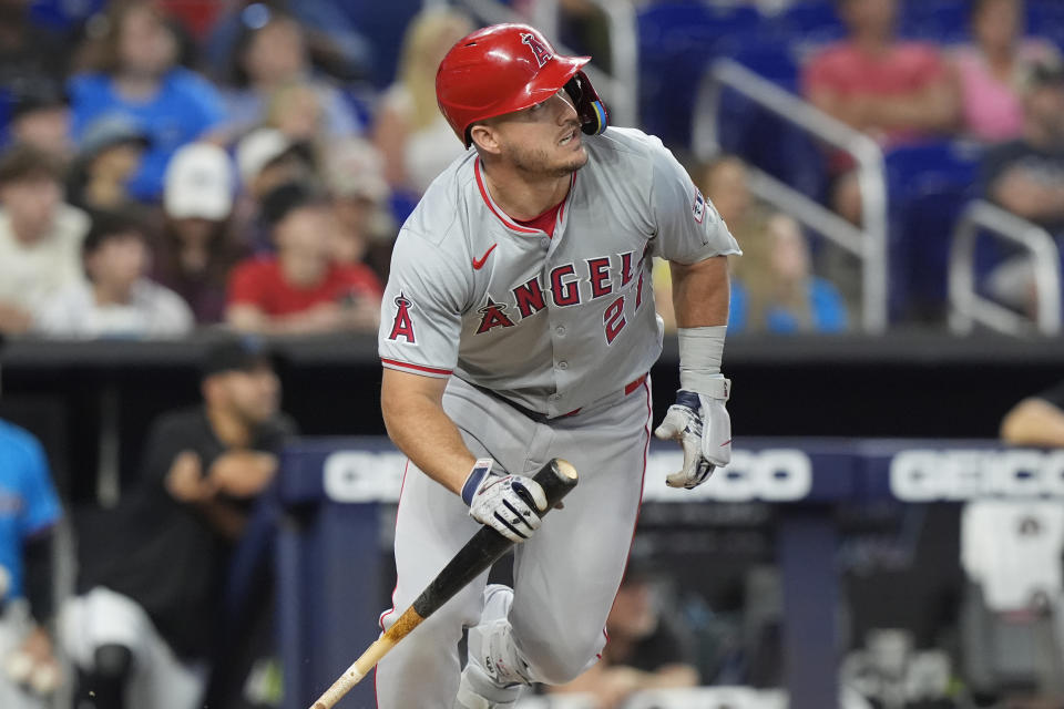 Los Angeles Angels' Mike Trout (27) hits a single during the first inning of a baseball game against the Miami Marlins, Wednesday, April 3, 2024, in Miami. (AP Photo/Marta Lavandier)