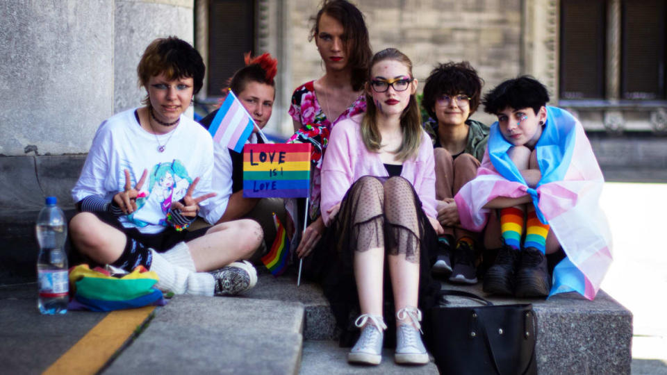 <div class="inline-image__caption"><p>A group of queer Polish students including Lea, Morticia, and Harley wait at Warsaw’s Pałac Kultury i Nauki/Palace of Culture and Science ahead of the joint Kyiv/Warsaw Pride march.</p></div> <div class="inline-image__credit">Courtesy of Randy R. Potts</div>