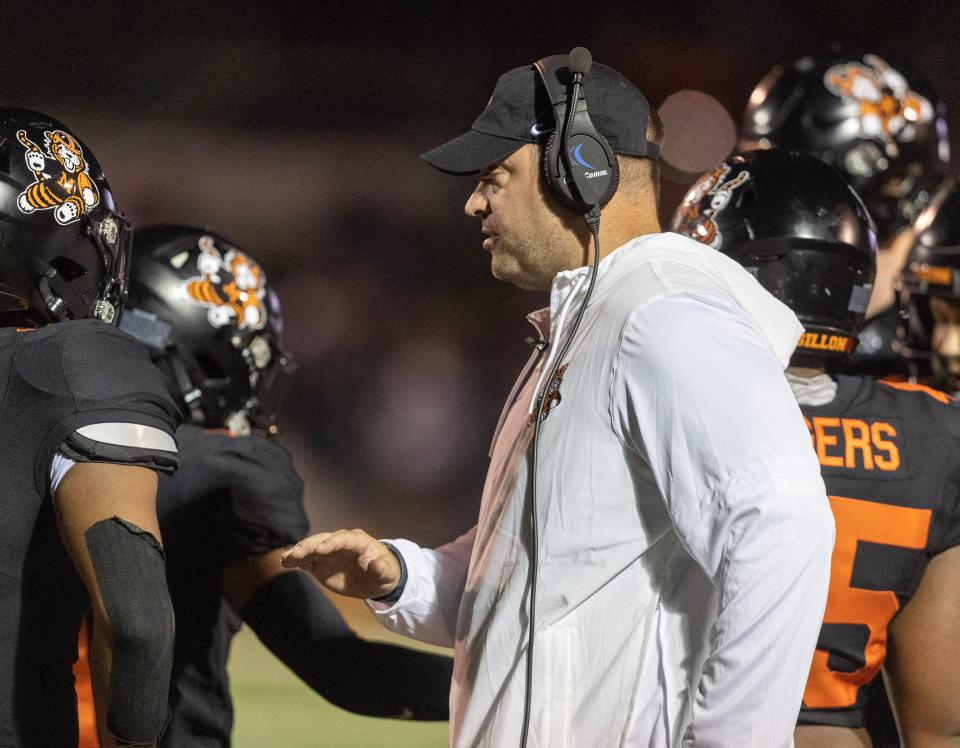 Massillon football coach Nate Moore talks with his team during a timeout against Valdosta (Ga.), Friday, Aug. 18, 2023.