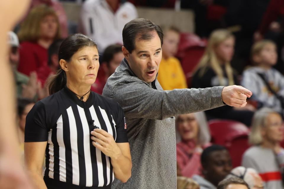 Baylor Bears head coach Scott Drew talks to an official.