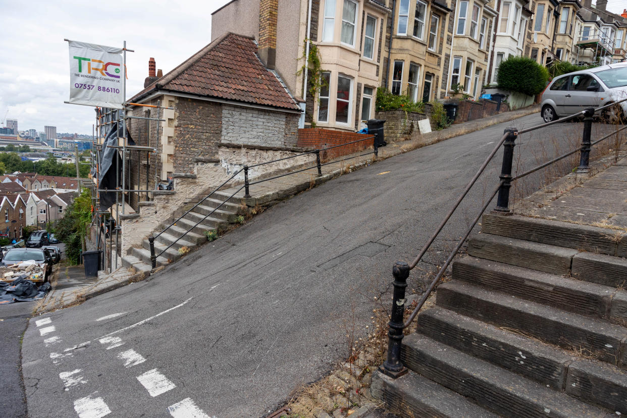 The 22-degree gradient incline of Vale Street in Bristol means delivery drivers won't drive up to houses, but residents say they wouldn't like to live anywhere else. (SWNS)

