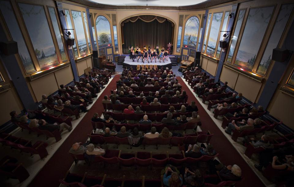 Local residents perform and watch a vaudeville show in celebration of the theatre's 100th anniversaruy. (Reuters)