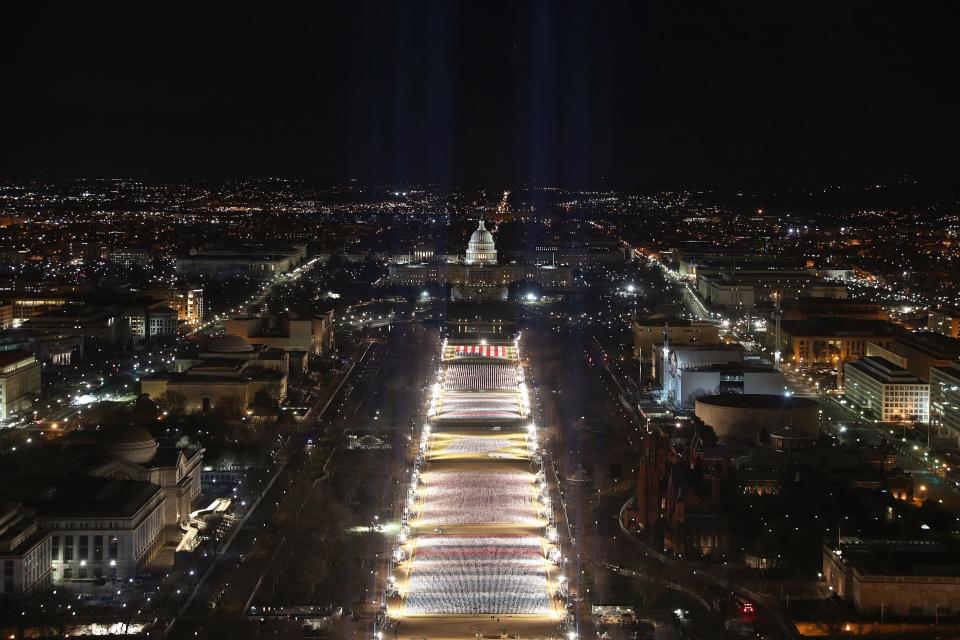 Pillars of light representing each U.S. state and territory light up the flag display. (Photo: JOE RAEDLE via Getty Images)
