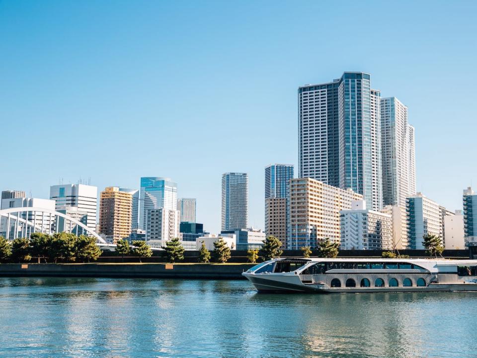 A boat on a waterway in Tokyo.