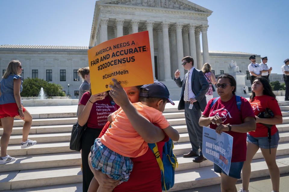 Demonstrators gather at the Supreme Court as the justices finish the term with key decisions on gerrymandering and a census case involving an attempt by the Trump administration to ask everyone about their citizenship status in the 2020 census, on Capitol Hill in Washington, Thursday, June 27, 2019. (AP Photo/J. Scott Applewhite)