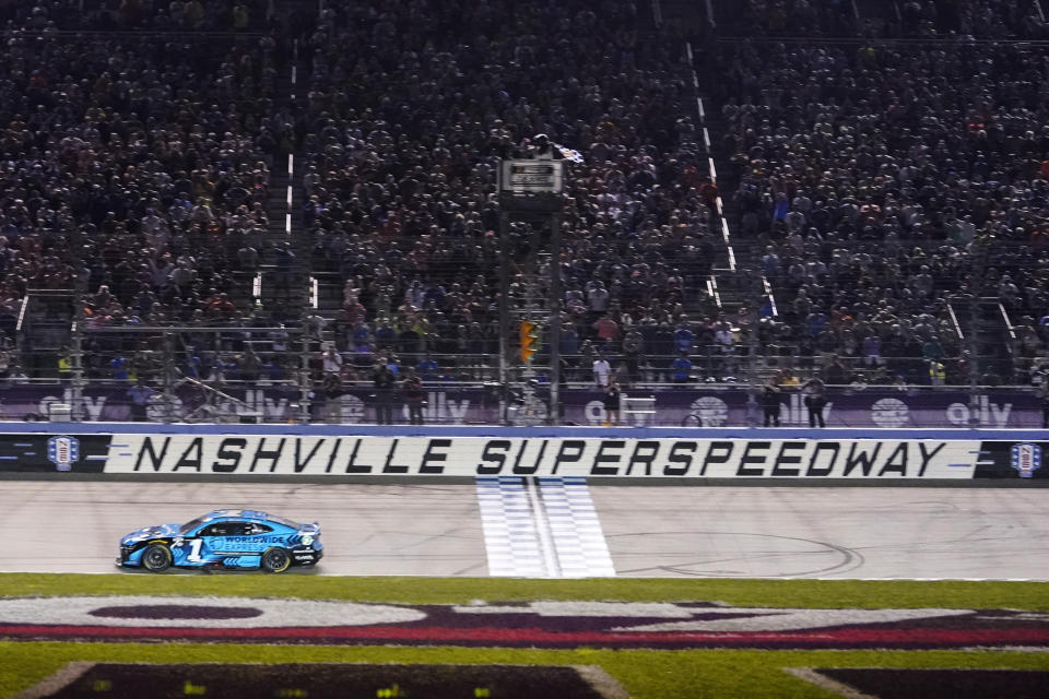 Ross Chastain crosses the finish line to win a NASCAR Cup Series auto race, late Sunday, June 25, 2023, in Lebanon, Tenn. (AP Photo/George Walker IV)