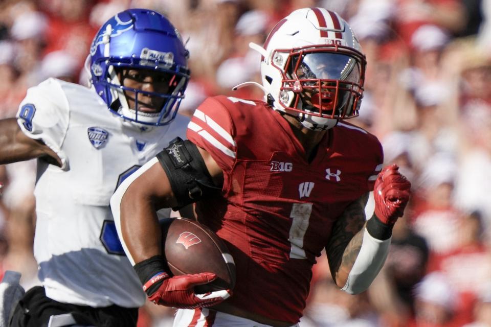 Wisconsin's Chez Mellusi (1) runs for a touchdown during the second half of an NCAA college football game against Buffalo Saturday, Sept. 2, 2023, in Madison, Wis. (AP Photo/Morry Gash)