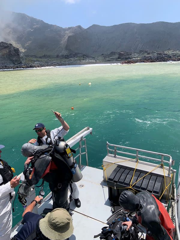 Members of a dive squad conduct a search during a recovery operation around White Island, which is also known by its Maori name of Whakaari, a volcanic island that fatally erupted earlier this week, in New Zealand