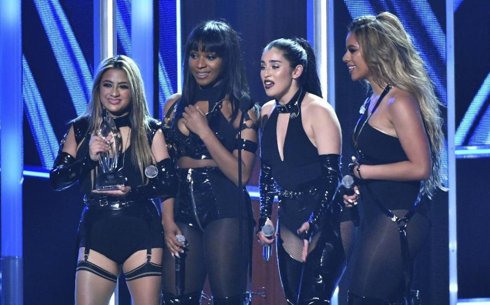 Ally Brooke, from left, Normani Hamilton, Lauren Jauregui, and Dinah Jane of the musical group Fifth Harmony accept the award for favorite group at the People's Choice Awards at the Microsoft Theater on Wednesday, Jan. 18, 2017, in Los Angeles. (Photo by Vince Bucci/Invision/AP)