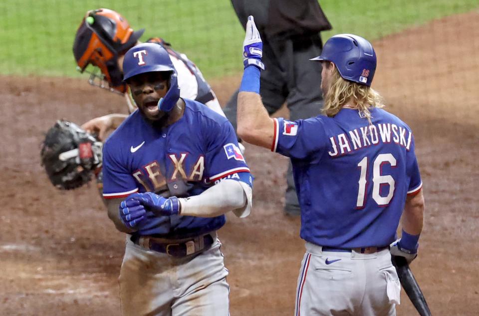 Adolis Garcia celebrates after hitting a home run during the eighth inning of Game 7 against the Houston Astros.