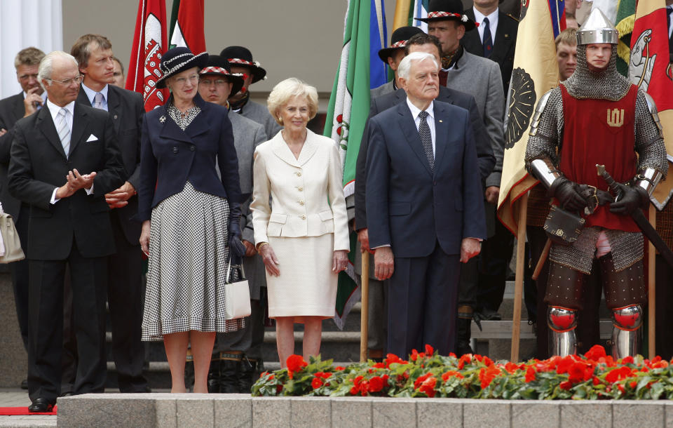 FILE - From left: Sweden's King Carl XVI Gustaf, Denmark's Queen Margrethe II, Lithuania's President Valdas Adamkus and his wife Alma Adamkiene attend a Flag Raising Ceremony at the S. Daukanto Square, in front of the Presidential Palace in Vilnius, Lithuania, Monday, July 6, 2009. Sweden's King Carl XVI Gustaf is the second-longest reigning European monarch alive today, after his cousin Queen Margrethe II, who celebrated her 50th anniversary on Denmark’s throne last year. (AP Photo/Mindaugas Kulbis, File)