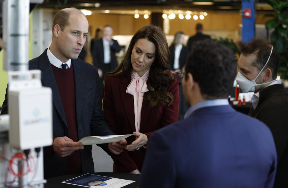 Britain's Prince William and Kate, Princess of Wales speak with startup companies that work at Greentown Labs as they tour the location for a view of green technologies developed in Somerville, Mass. Thursday, Dec. 1 2022. The Prince and Princess of Wales will attend the Earthshot Prize Awards Ceremony in Boston on Friday, according to the Royal Household. (CJ Gunter Pool Photo via AP)