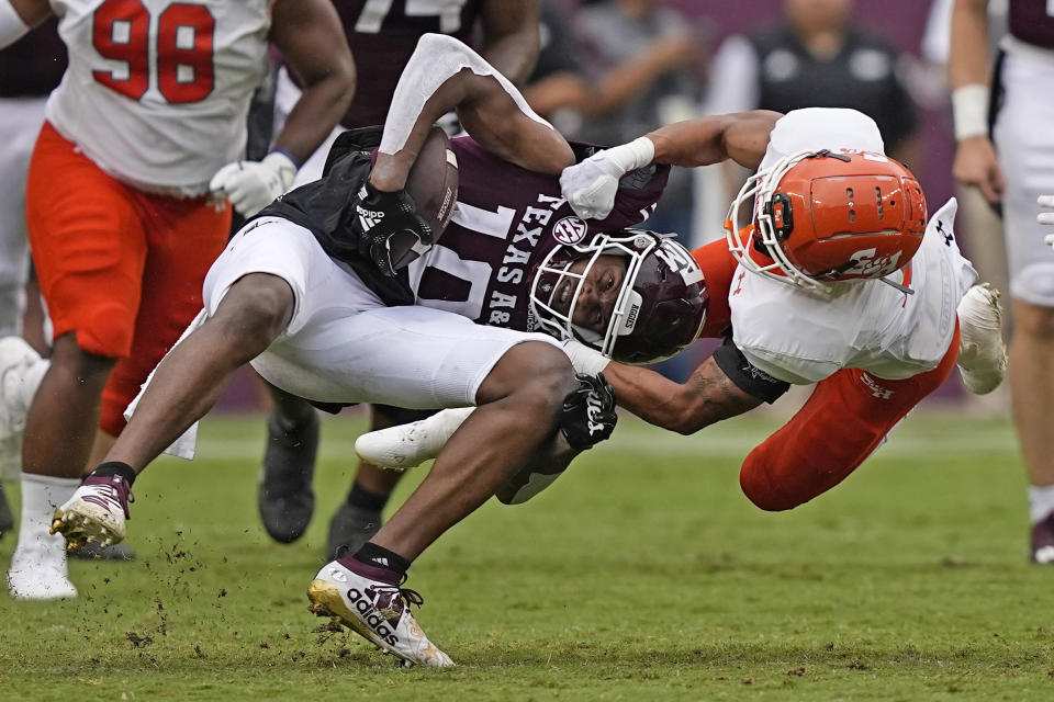 Texas A&M wide receiver Chris Marshall (10) is tackled by Sam Houston State defensive back Isaiah Downes (4) during the second half of an NCAA college football game Saturday, Sept. 3, 2022, in College Station, Texas. (AP Photo/David J. Phillip)