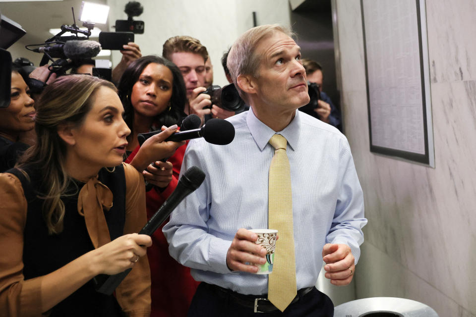 Rep. Jim Jordan with reporters inside the Capitol.