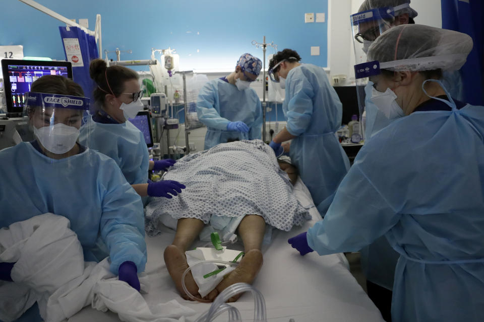 Critical Care staff look after a COVID-19 patient on the Christine Brown ward at King's College Hospital in London, Wednesday, Jan. 27, 2021. (AP Photo/Kirsty Wigglesworth, Pool)