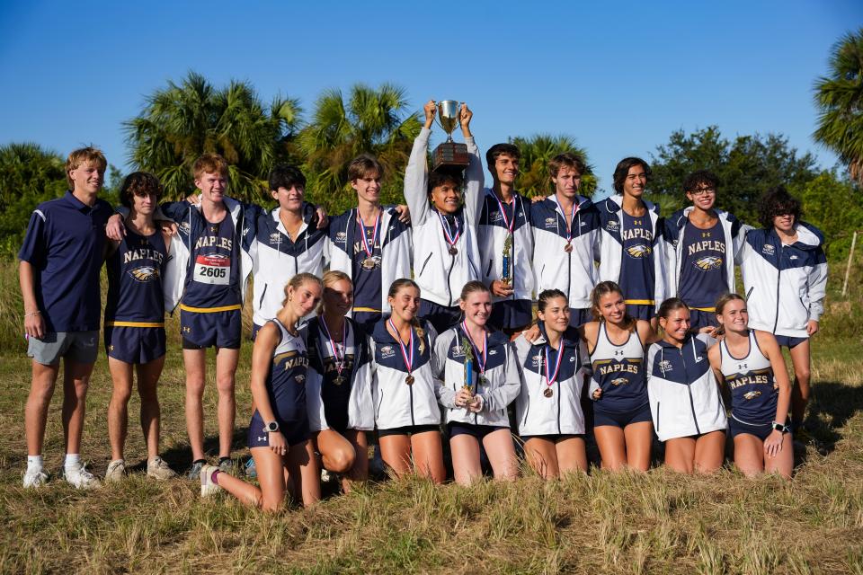 Naples runners celebrate after winning the Collier County Athletic Conference cross country championship at Palmetto Ridge High School in Naples on Wednesday, Oct. 25, 2023.