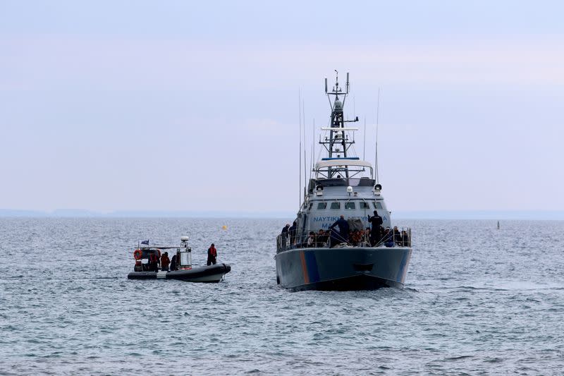 FILE PHOTO: Syrian refugees arrive on a Cyprus coast guard boat to the south-east of the island in the region of Protaras