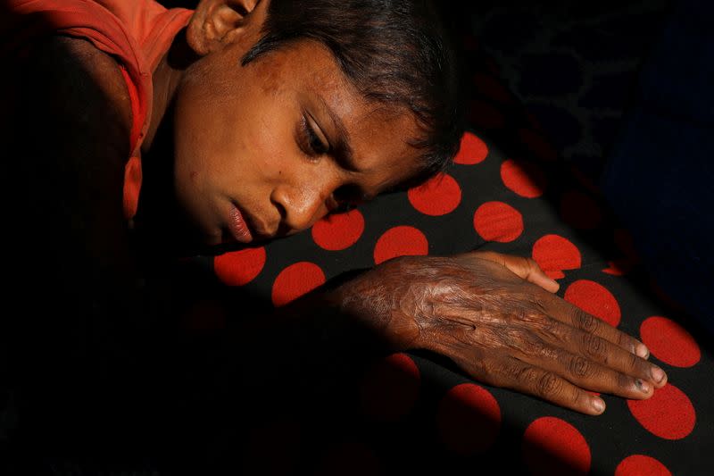 The Wider Image: 'Can't take this pain': Rohingya mother searches for son after refugee camp blaze