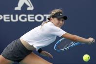 Mar 20, 2019; Miami Gardens, FL, USA; Amanda Anisimova of the United States reaches for a backhand against Andrea Petkovic of Germany (not pictured) in the first round of the Miami Open at Miami Open Tennis Complex. Geoff Burke