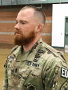 This August, 2019 photo provided by the Nevada Army National Guard shows Sgt. 1st Class Benjamin Hopper of the Nevada Army National Guard at a deployment ceremony in Nevada. Hopper, who is serving in Afghanistan, has received a uniform religious exception to sport a beard based upon his Norse pagan beliefs. He is the first guard soldier to receive a religious accommodation approval for a beard. (Sgt. 1st Class Erick Studenicka/Nevada Army National Guard via AP)