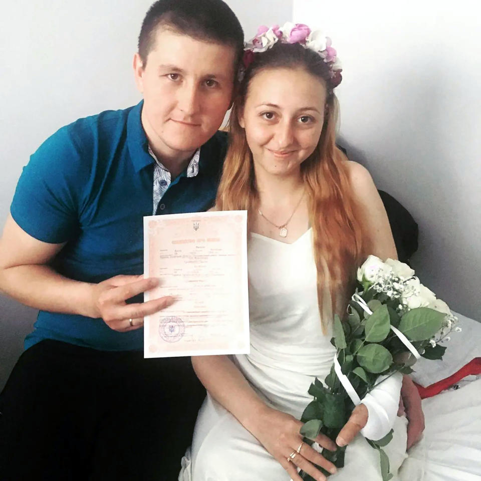 Ukrainian nurse Oksana Balandina, 23, from Lysychansk, who lost her legs in an exploding mine, and her long-time boyfriend Victor Vasilyev in hospital.