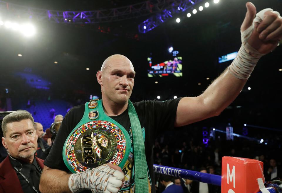 Tyson Fury, of England, celebrates after defeating Deontay Wilder during a WBC heavyweight championship boxing match Saturday, Feb. 22, 2020, in Las Vegas. (AP Photo/Isaac Brekken) ORG XMIT: NVJL325