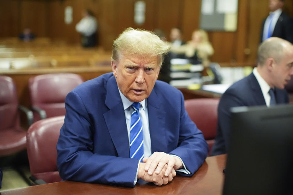 Former President Donald Trump awaits the start of proceedings on the second day of jury selection at Manhattan criminal court, Tuesday, April 16, 2024, in New York. Donald Trump returned to the courtroom Tuesday as a judge works to find a panel of jurors who will decide whether the former president is guilty of criminal charges alleging he falsified business records to cover up a sex scandal during the 2016 campaign. (AP Photo/Mary Altaffer)