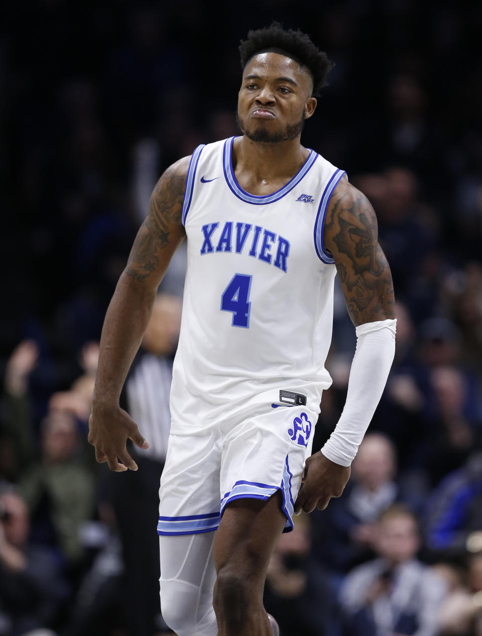 Xavier forward Tyrique Jones (4) reacts to a basket against Villanova during the second half of an NCAA college basketball game, Saturday, Feb. 22, 2020, in Cincinnati. (AP Photo/Gary Landers)