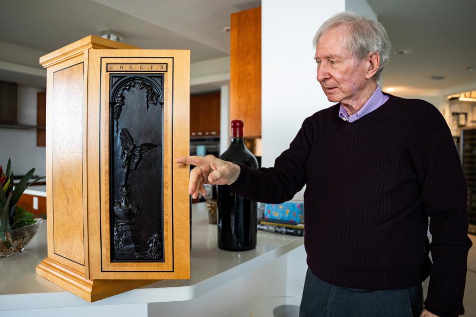 Brian Cobb opens a wine display box created by Lord Linley (Princess Margaret's son) from 2002.