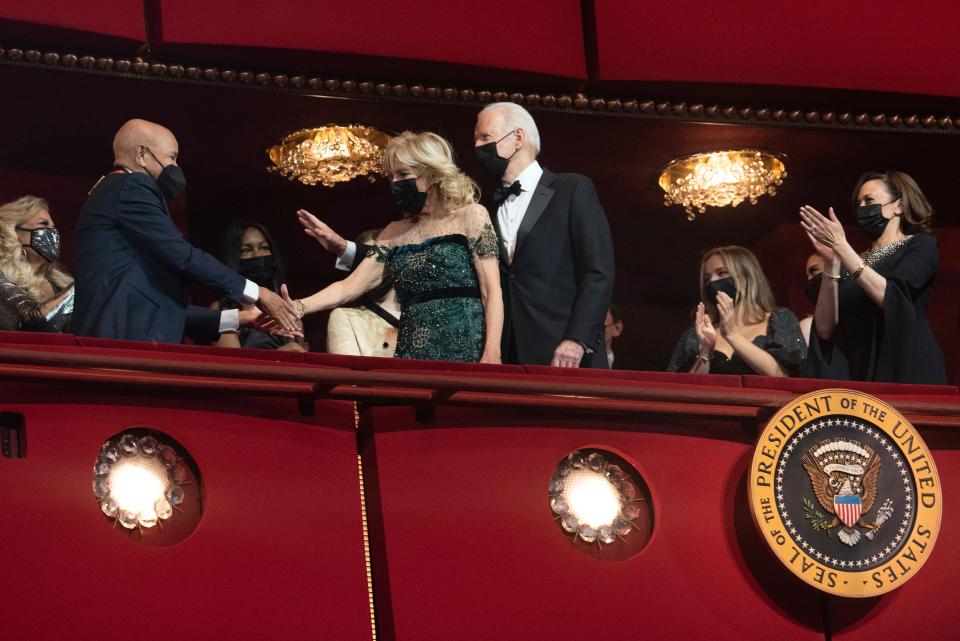 President Joe Biden and first lady Jill Biden congratulate 2021 Kennedy Center honoree Berry Gordy, left, at the start of the honors gala for the 44th Kennedy Center Honors on Sunday, Dec. 5, 2021, in Washington. At right is Vice President Kamala Harris (AP Photo/Kevin Wolf)