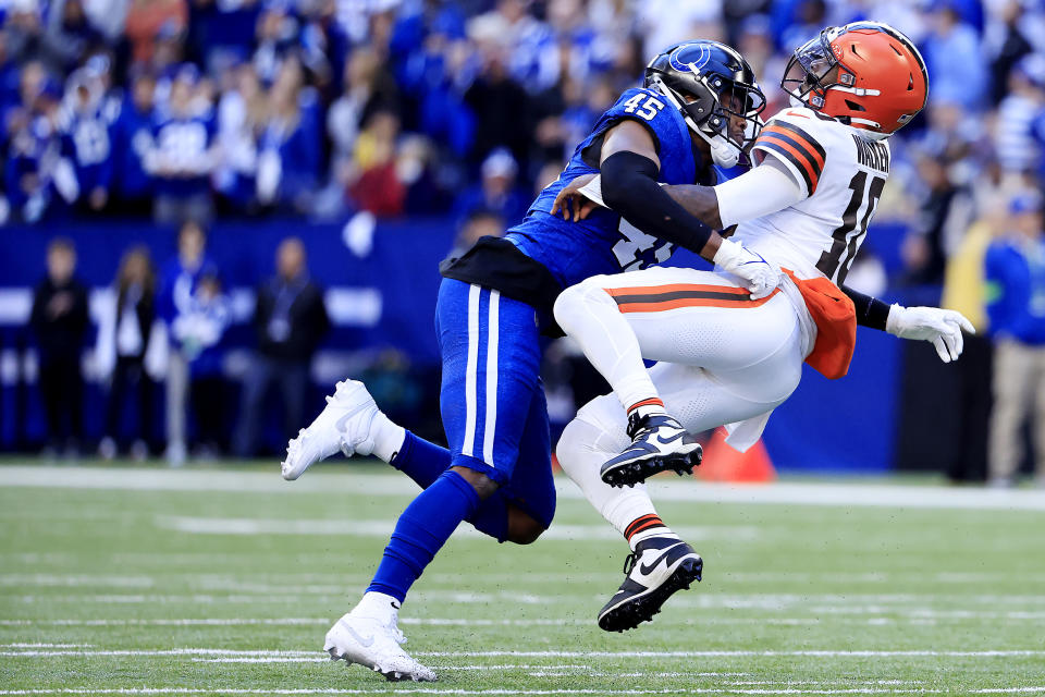 INDIANAPOLIS, INDIANA - OCTOBER 22: PJ Walker #10 of the Cleveland Browns is tackled by E.J. Speed #45 of the Indianapolis Colts during the fourth quarter at Lucas Oil Stadium on October 22, 2023 in Indianapolis, Indiana. (Photo by Justin Casterline/Getty Images)