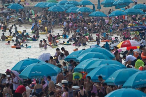 A general view shows holiday-makers on a beach at the seaside town of Beidaihe, 285 km east of Beijing, on August 6. China's leaders, including the man expected to be the next president, have begun their secretive summer meetings at the resort, state press said on August 5, ahead of a once-in-a-decade transition of power