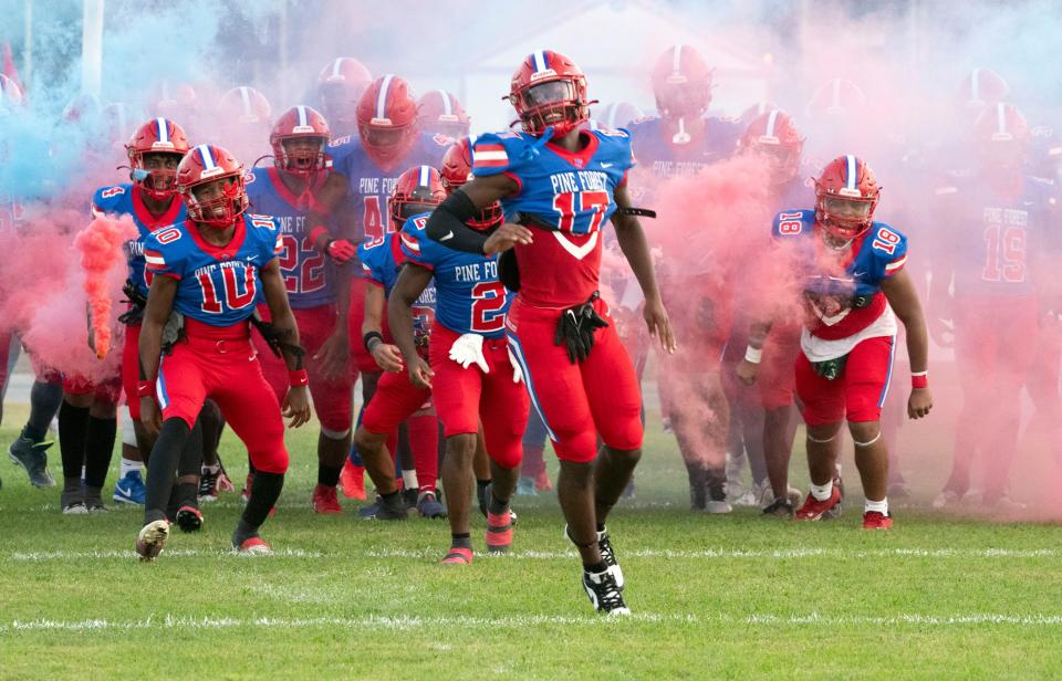 The Pine Forest Eagles football team storms the field to take on the Navarre Raiders on Friday, September 1, 2023.
