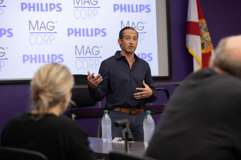 Jeff Whalen, director of MagCorp, talks to Philips representatives during a meeting in Tallahassee, Fla.