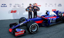 Spain Formula One - F1 - 2017 Toro Rosso STR12 Formula One Car Launch - Barcelona-Catalunya racetrack in Montmelo - 26/2/17. Toro Rosso's drivers Daniil Kvyat (R) and Carlos Sainz pose during the presentation of the new STR12 racing car. REUTERS/Albert Gea