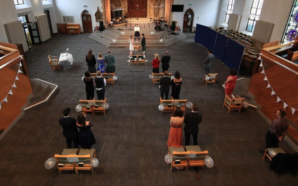 The socially distanced wedding of Tom Hall and Heather McLaren, at St George's Church, Leeds, on July 4  - PA