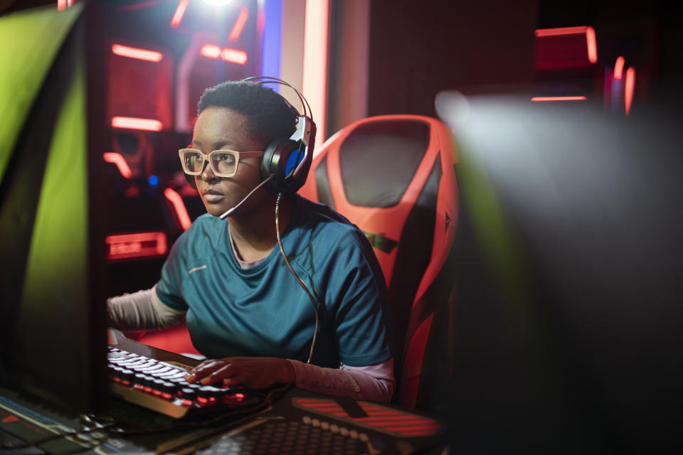 Close up of a female eSports team competing in an eSports tournament at an eSports Venue