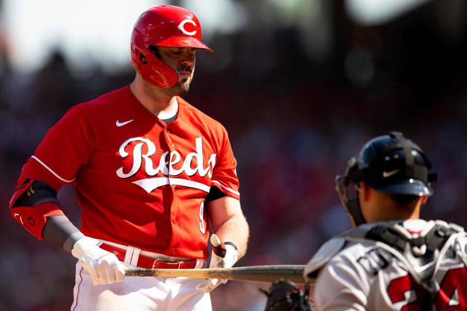 Cincinnati Reds first baseman Mike Moustakas (9) reacts to striking out in the second inning of the MLB game between the Cincinnati Reds and the Atlanta Braves at Great American Ball Park in Cincinnati on Saturday, July 2, 2022.