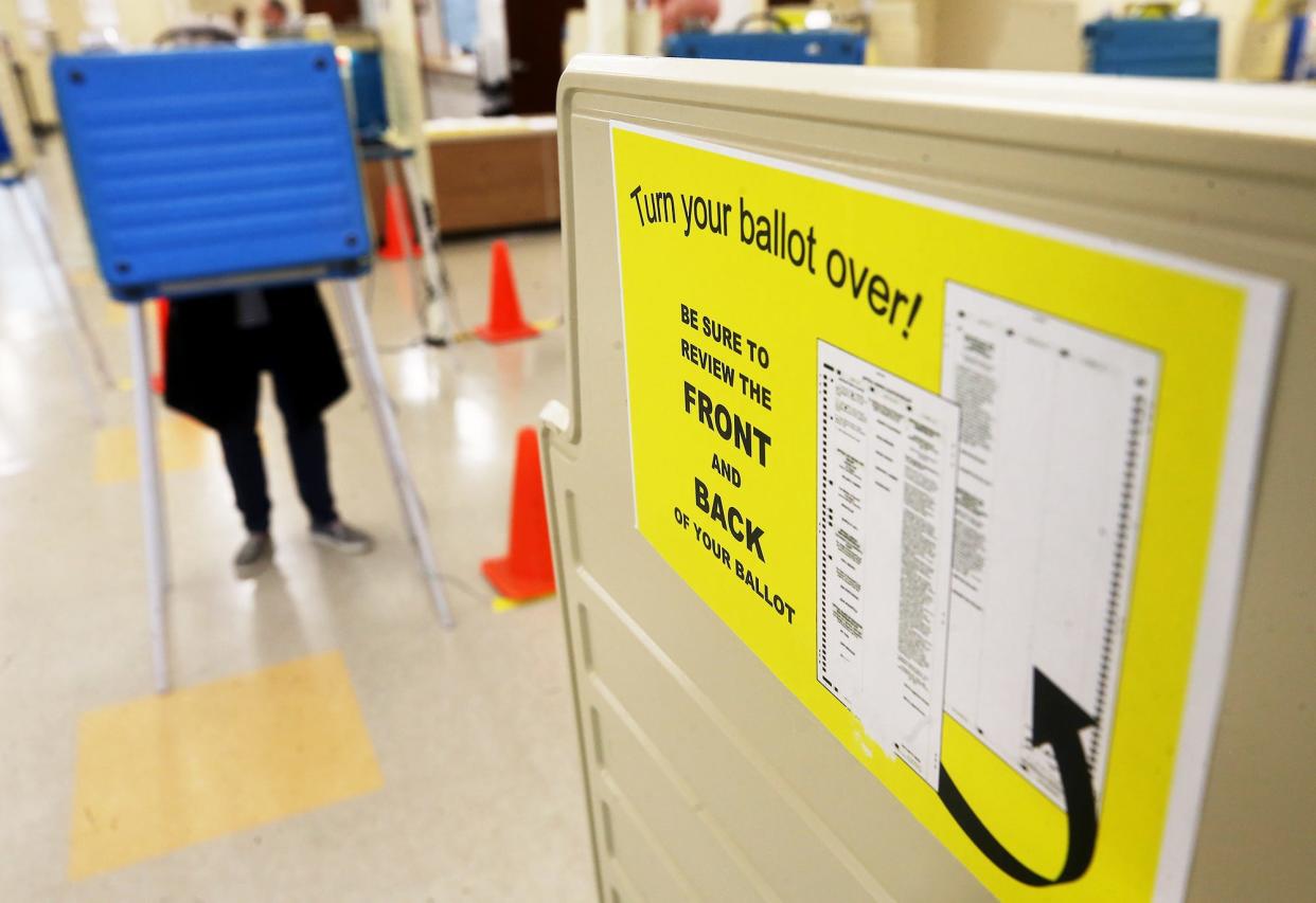 An Akron resident votes early at the Summit County Board of Elections on Wednesday.