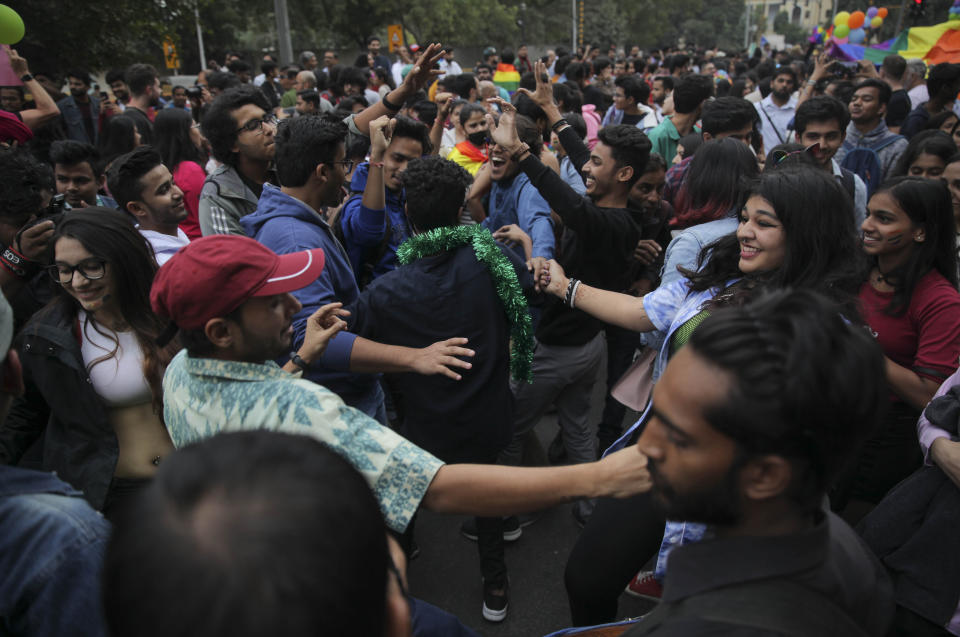 Members of the LGBTQ community and their supporters dance during the annual Delhi Queer Pride parade in New Delhi, India, Sunday, Nov.24, 2019. More than 1,000 members of the LGBTQ community and their supporters marched through New Delhi to celebrate India’s sexual diversity, which they say is progressing but still has a long way to go to become a more accepting place for them. (AP Photo/ Rishabh R. Jain)