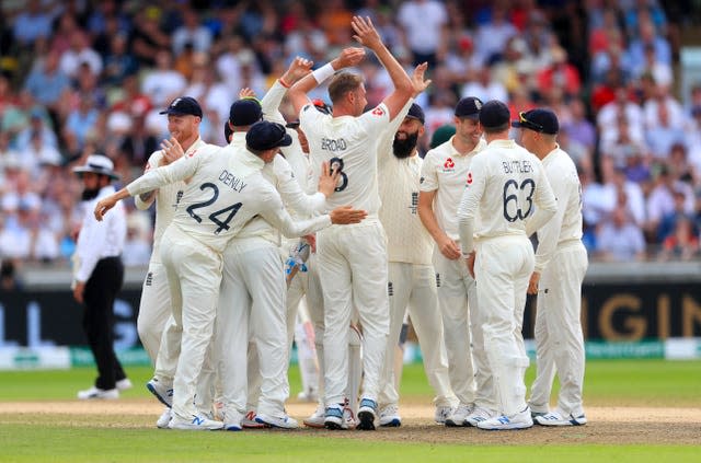 Stuart Broad, centre, celebrates taking the wicket of Australia’s David Warner at Edgbaston in 2019